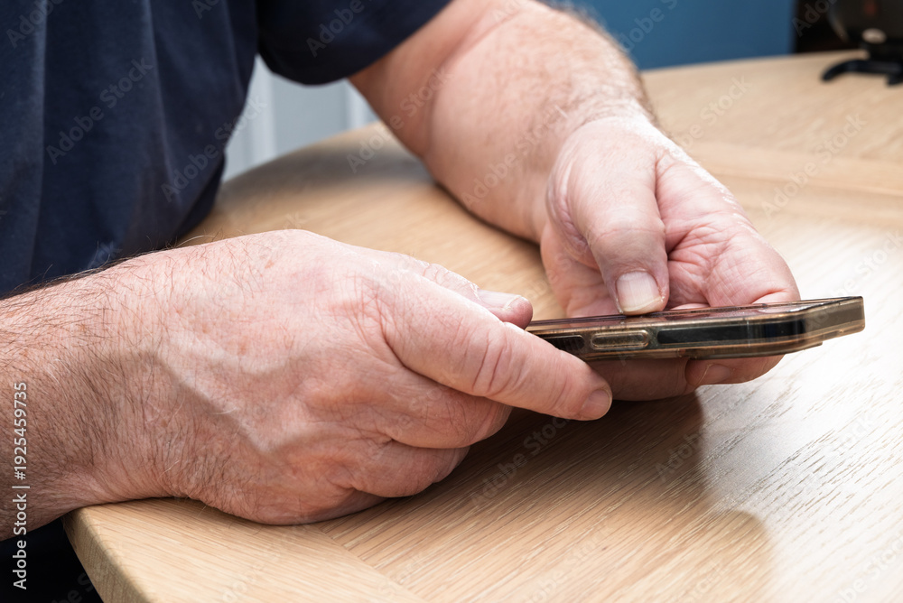 Obraz premium An elderly person using a smart phone and new technology.