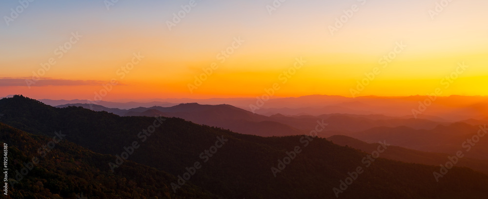 Fototapeta premium Beautiful natural panoramic countryside landscape with mountains at sunset. Rainforest ecosystem and healthy environment concept background. Nature background.