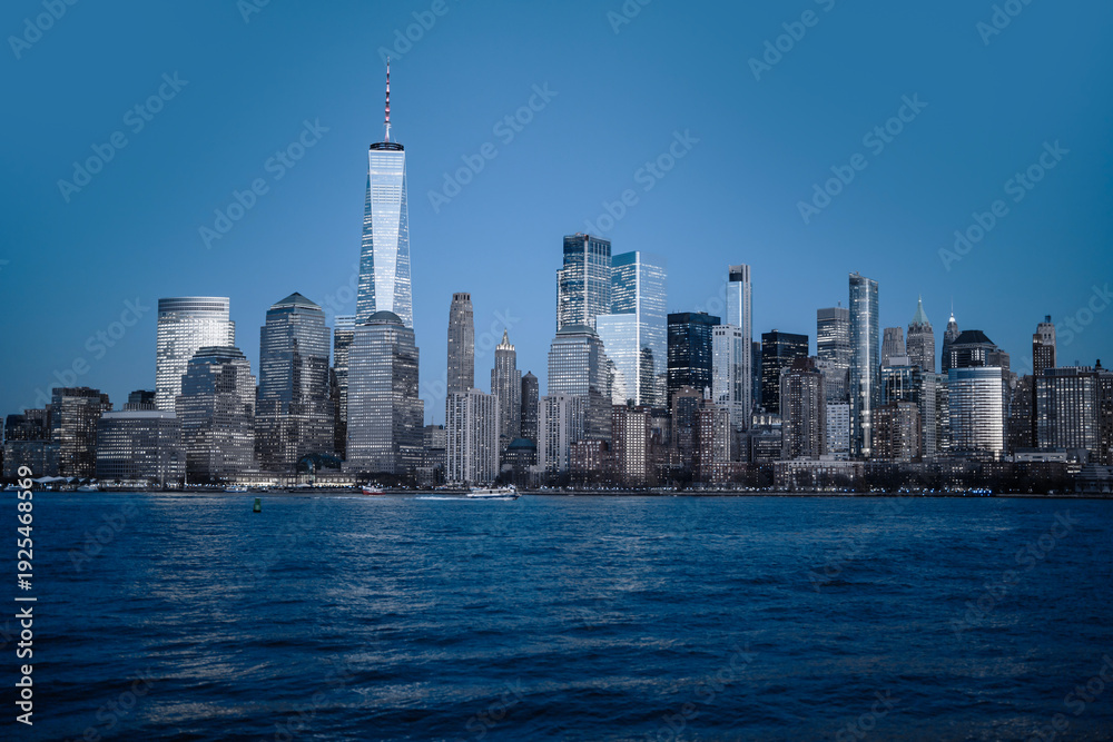 Obraz premium New York NYC skyline scenic river view. New York City skyline iconic panorama. New York Manhattan skyline photography scene. New York NYC skyline modern American city.