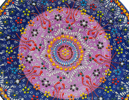 Background with Tunisian traditional ceramic in the plate form, painted with specific patterns.