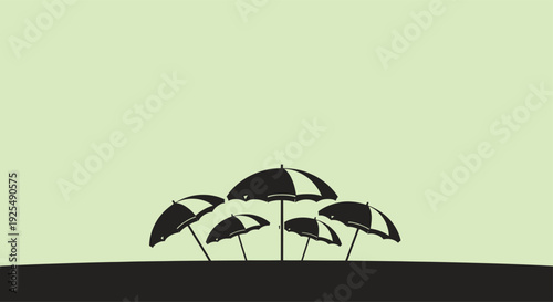 Beach Umbrellas Silhouette on Dune at Sunset