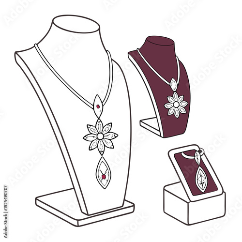 A set of three snowflake necklaces on display