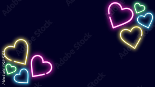 暗い紺の背景にカラフルなネオンハートが対角に輝くシンプルでポップな16:9フレーム背景