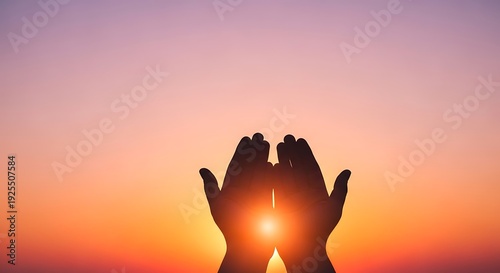 Hands cupped together at sunset with sun shining through