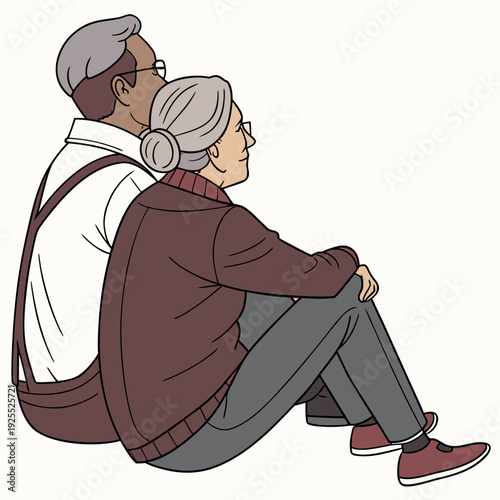 An elderly couple sitting together on the floor