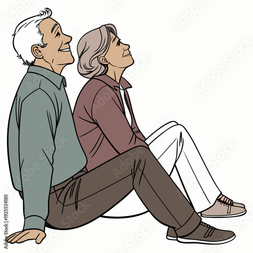 An older couple sitting on the floor laughing