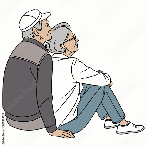 An elderly couple sitting together on the ground