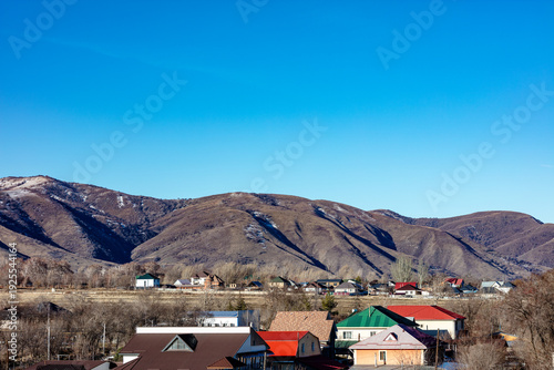 Landscape, mountain, trees, snow, city, winter, river, stream.