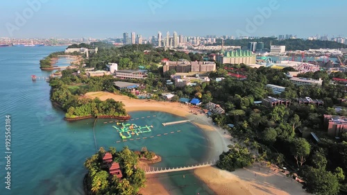 Sentosa Island, Singapore: Aerial view of Palawan Beach on famous island resort, tropical white sand, lush greenery - landscape panorama of Southeast Asia from above
