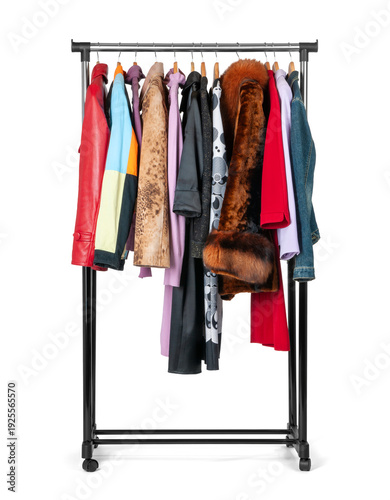 Mobile clothing rack with assorted women’s apparel, side view. Dresses, jackets and fur coat on hangers. Isolated on transparent background, high quality PNG file.