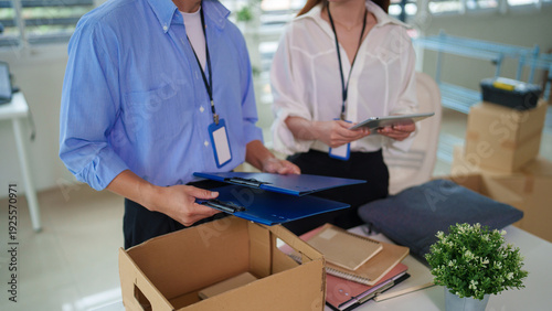 Fotografie Asian adult professionals managing office relocation process planning teamwork o