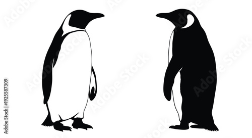 Two penguins facing each other in a striking black silhouette