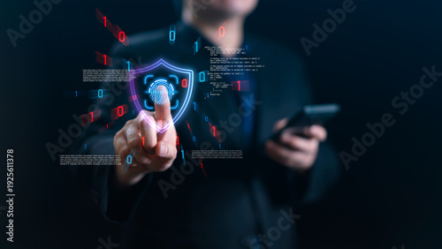 Businessman touching virtual fingerprint scanner with shield icon and binary code. Concept of cybersecurity, data protection, biometrics authentication, and privacy in digital network.