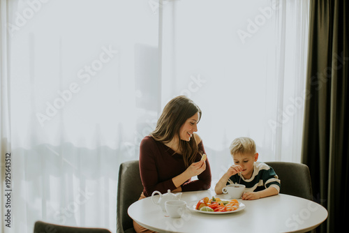 Mother and son share a snac...