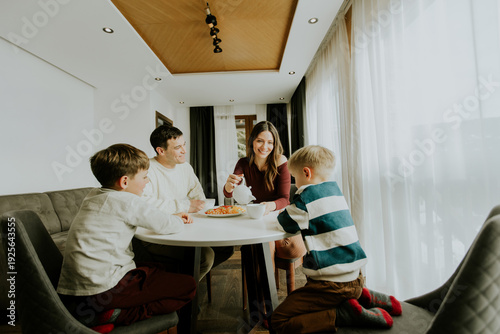 Family enjoys breakfast tog...