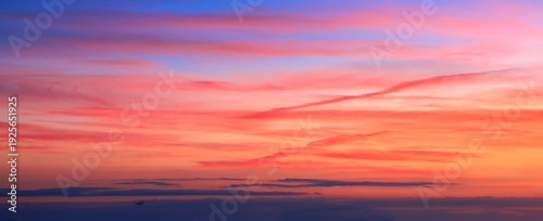 Wonderful New Zealand evening sky replacement of very colorful sky. Horizon a layer of grey dark cloud.