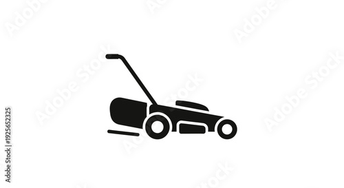 Lawn mower cutting grass on a sunny day outdoors