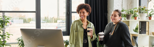 Foto Collaboration in a modern office with empowered women in diverse business enviro