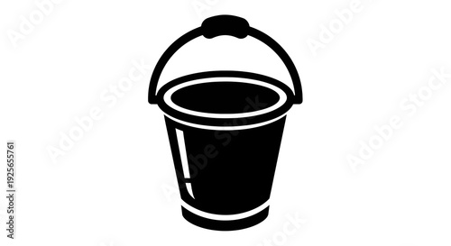 Black bucket with a handle resting on a flat surface