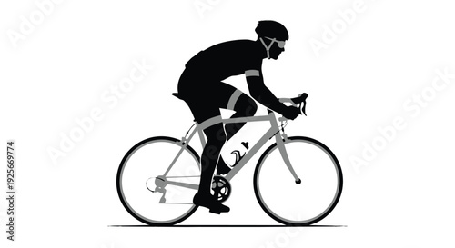 Cyclist riding bicycle in silhouette