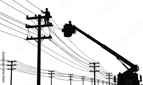 Silhouette of two workers on a crane repairing power lines on utility poles