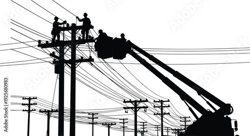 Silhouette of workers on a crane repairing power lines on utility poles
