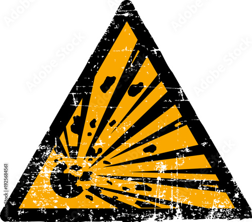 Grunge explosive materials warning sign worn scratched ISO 7010 W002 hazard symbol