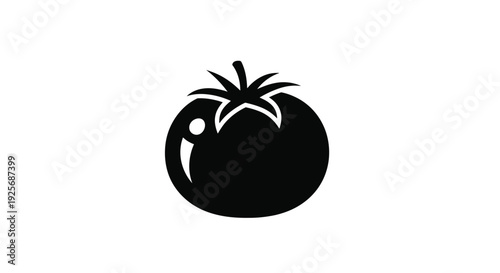 A striking black silhouette of a ripe tomato with a leaf silhouette