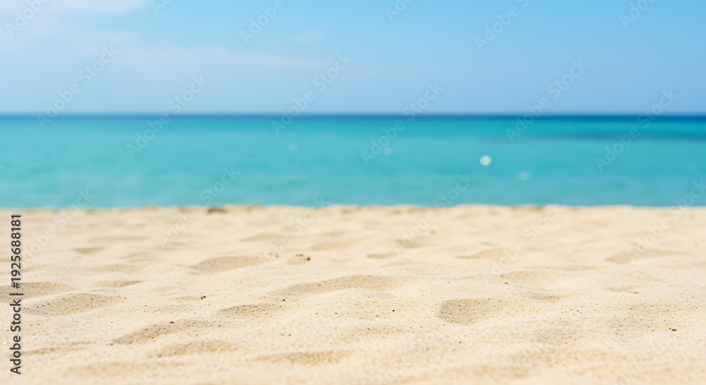 Obraz premium Beach sand and sea water on a sunny day with blue sky beautiful natural scenery