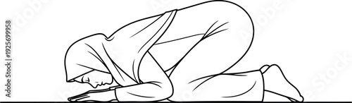 Woman in hijab kneeling in prayer with hands on ground