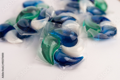 Close-up of a laundry pod with blue and green liquid detergent
