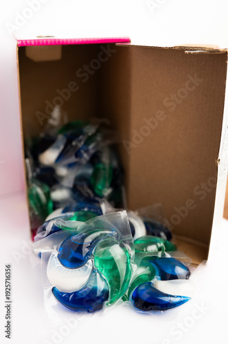 Close-up of a laundry pod with blue and green liquid detergent