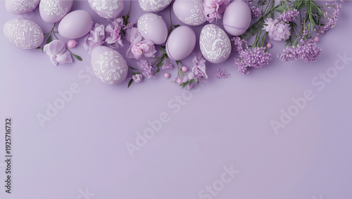 Lavender Easter eggs with white and flowers on purple background with Happy Easter text