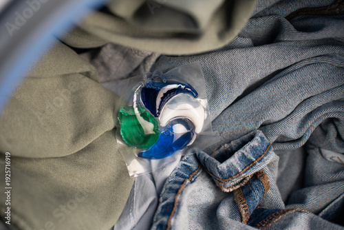 Close-up of a laundry pod with blue and green liquid detergent