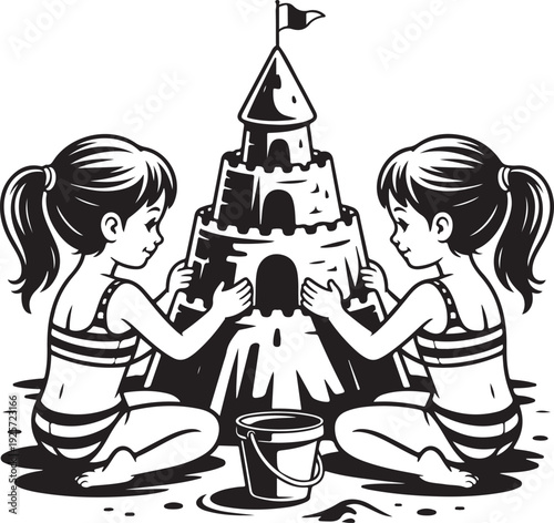 Two Young Girls Building A Sandcastle Together On The Beach With A Bucket