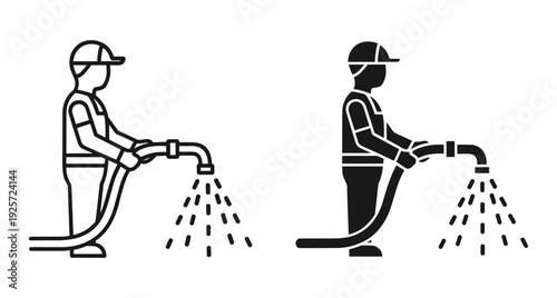 Professional worker using high pressure hose to spray water for cleaning or gardening