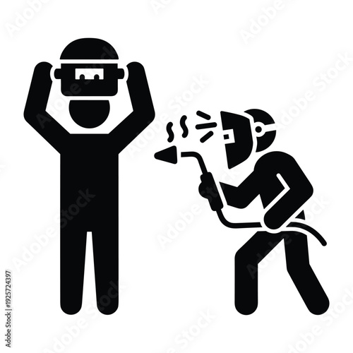 Two industrial workers wearing safety gear and using welding equipment for metal manufacturing