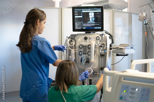 Tableau sur toile Medical team preparing hemodialysis machine for patient treatment