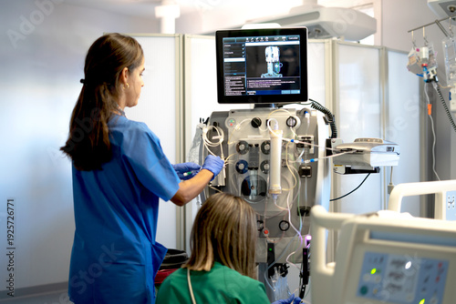 Photos Medical team preparing dialysis equipment in a hospital setting