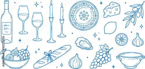 Elegant wine and cheese dinner setup with bread grapes and candlelight on a decorative plate with a beautiful floral pattern