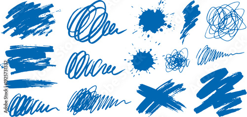 Collection of blue brush strokes and splatters on white background for artistic design