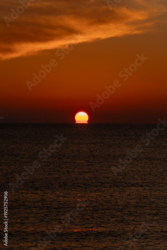 spectacular sunrise and sunset over the sea