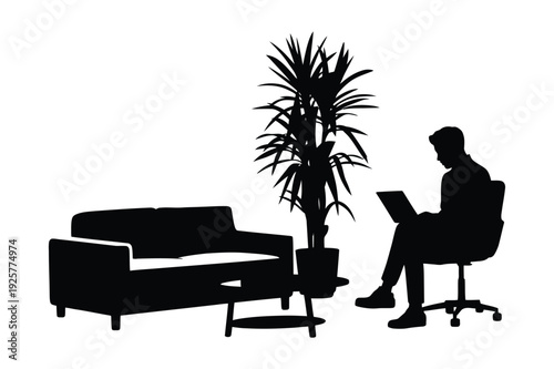 Silhouette of man working on laptop in modern office waiting area