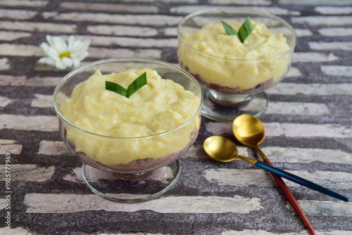 Ketan durian or Sticky rice durian. traditional dessert from Indonesia made from steamed red glutinous rice and topped with durian sauce and pandan leaf