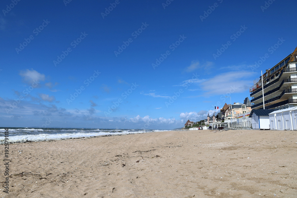 Obraz premium Blonville-sur-Mer Beach with White Beach Huts, Normandy, France. 
