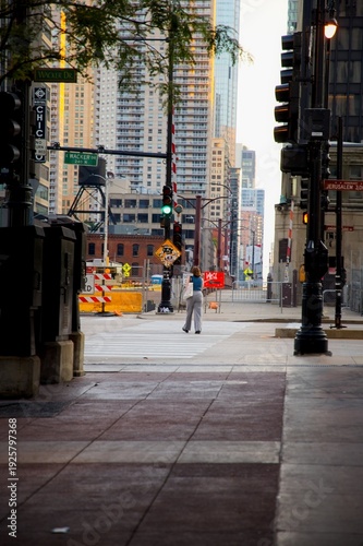 Wallpaper Mural View of a person walking down the street with Chicago Buildings in the background at Sunrise Torontodigital.ca