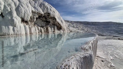 Pamukkale Travertine Terraces, amazing aqua blue pools of thermal mineral-rich spring water set against a geological rock formation, world heritage site and popular tourism destination in Turkey