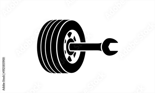 Black and white illustration of a tire and wrench.