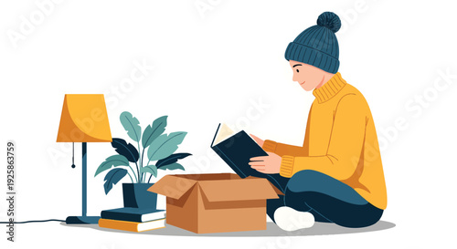 Young man unpacking box reading book surrounded by home decor.