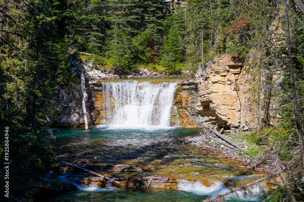 Obraz premium Small waterfall in the Johnston Canyon in Banff National Park, Alberta, Canada